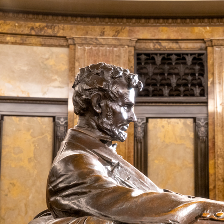 A bronze statue of Abraham Lincoln